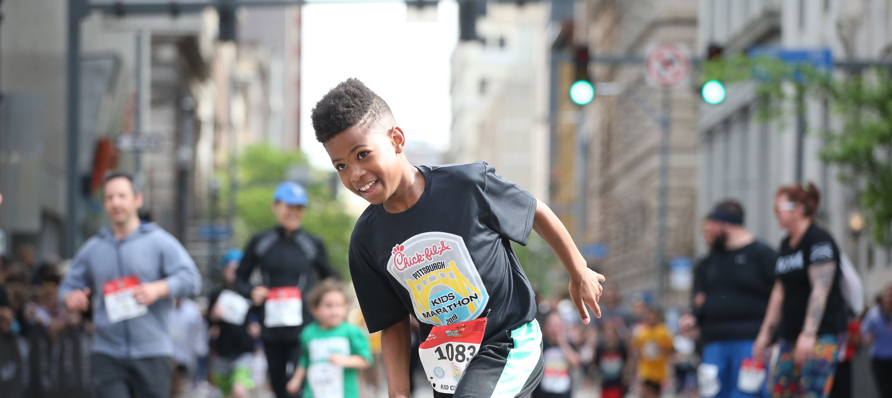 Young boy running in the Chick-fil-A Pittsburgh Kids Marathon