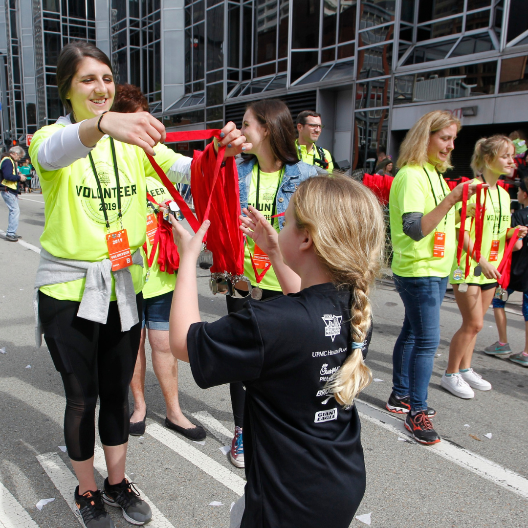 Girl receiving a medal after a race