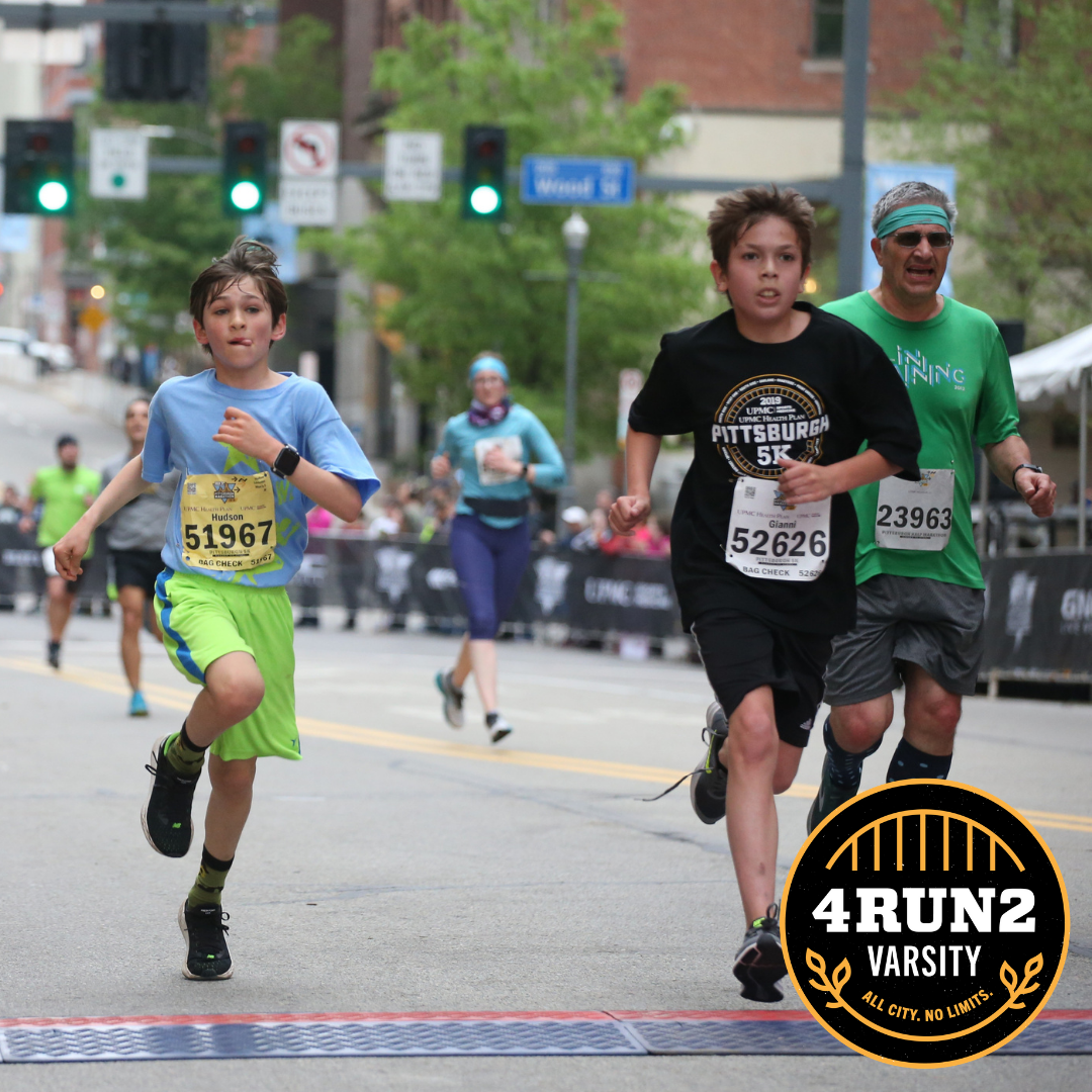Kids crossing a 5K finish line