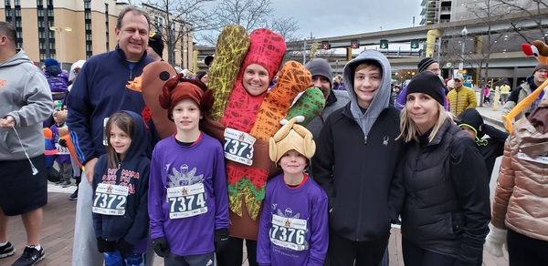 Family dressed in turkey costumes for the 2019 Turkey Trot