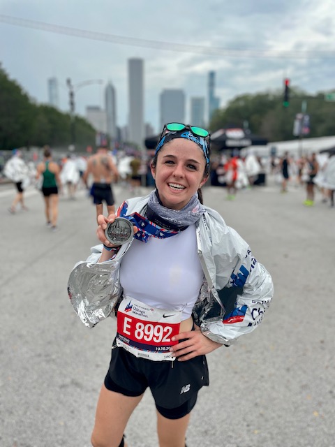 Kayla posing with finisher medal