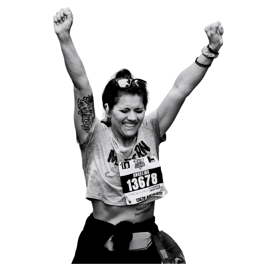 A woman celebrates at the finish line