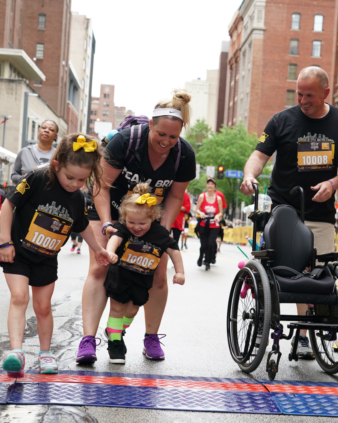 A participant crosses the finish line at the Champions Mile