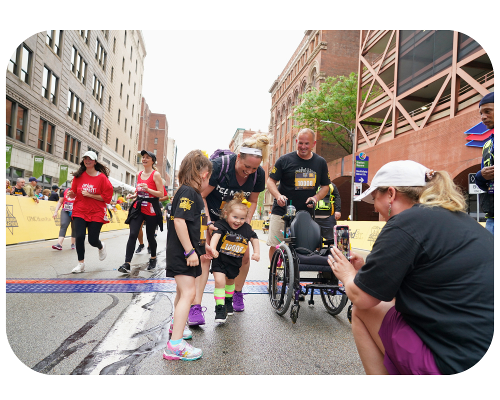 A participant crosses the finish line at the Champions Mile