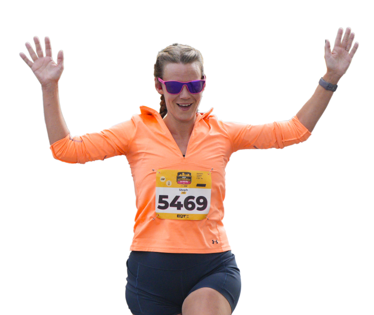 Woman running with her arms up in the air
