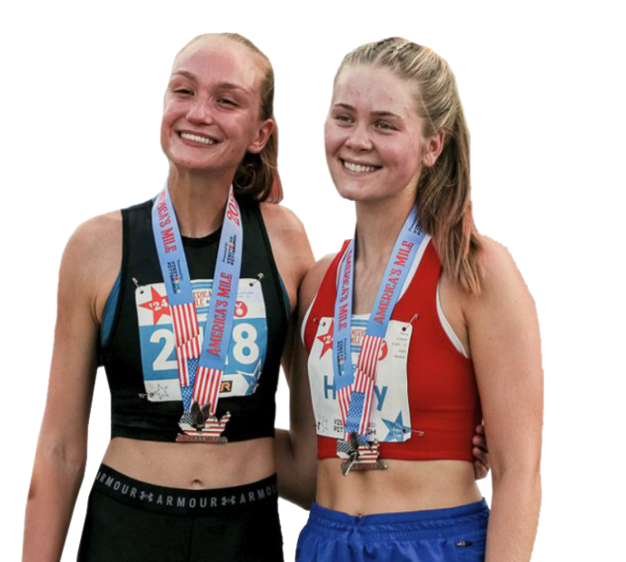 Two women smiling with their medals