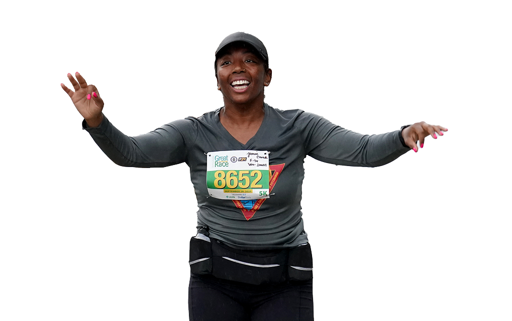 Woman running with her arms up.