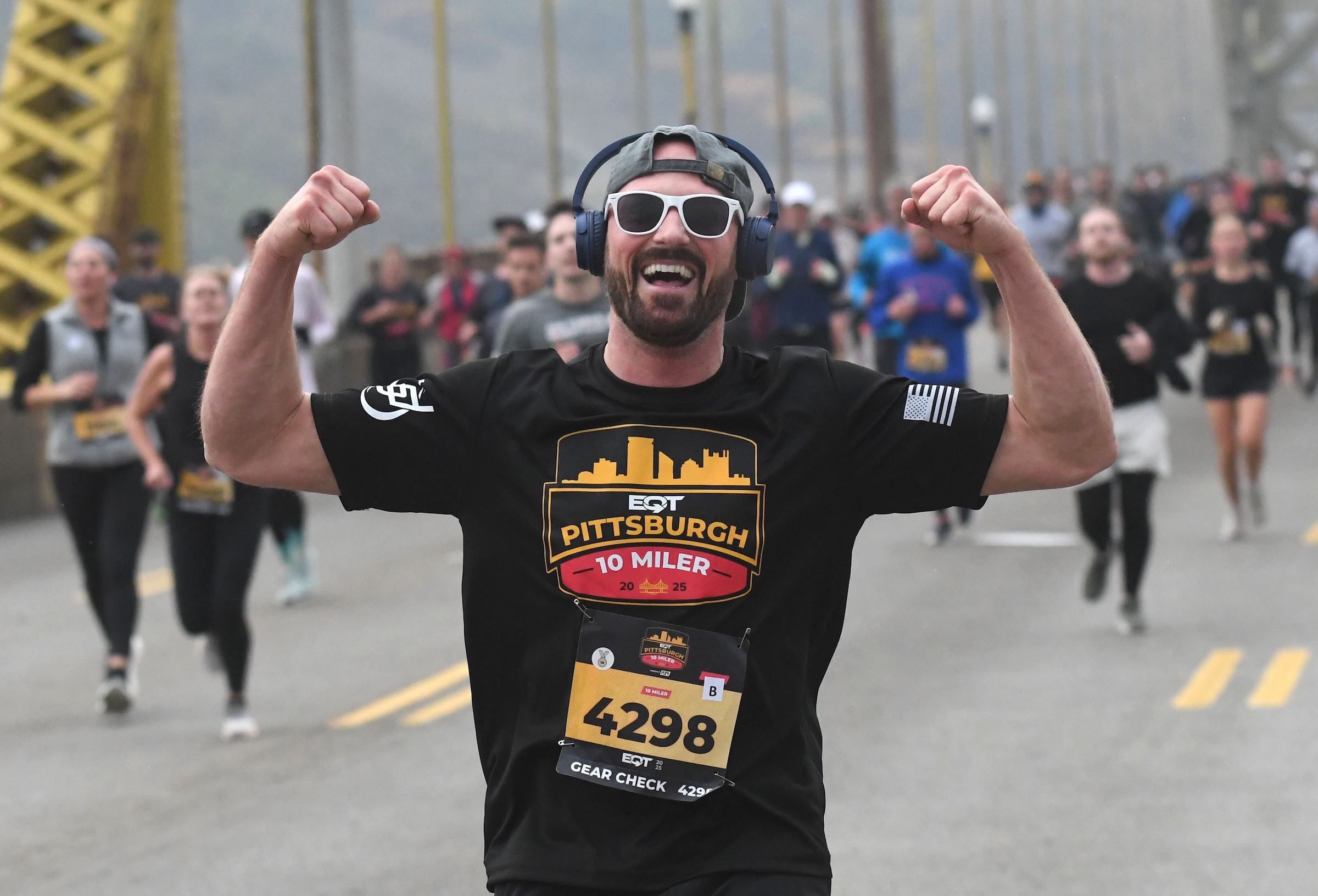 Man running with while flexing his arms