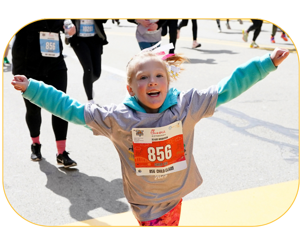 Young child participating in the 2026 Chick-fil-A Pittsburgh Kids Marathon