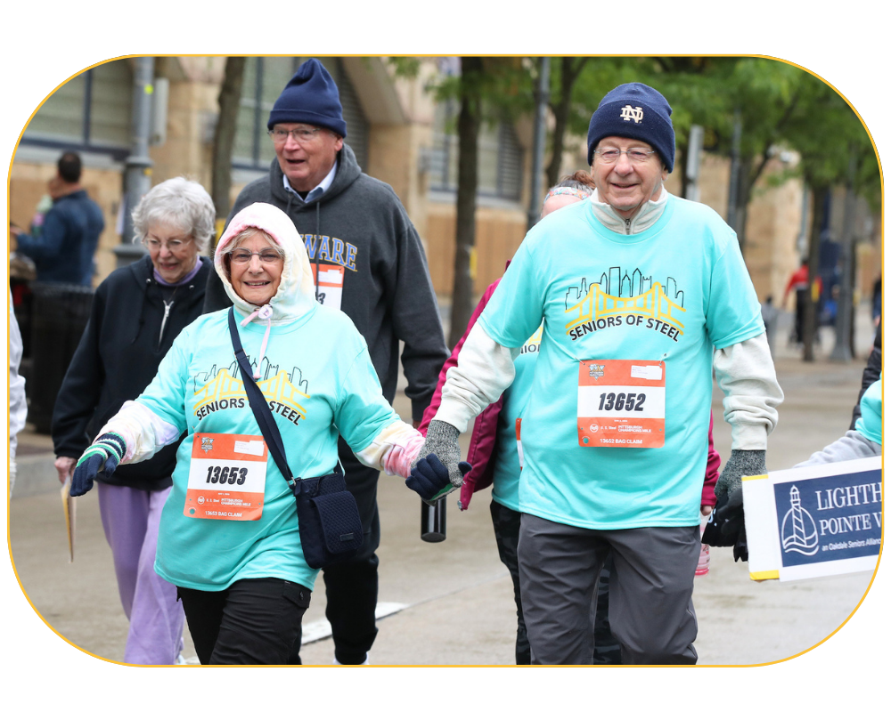Participants walk during the Champions Mile